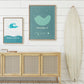 Waves Tide Map Poster and Nautical Tide Map Poster on a wall next to a surfboard in a home setting. Waves Tide Map Posters by Salt Atlas are custom posters showing the tide, astrology zodiac sign, and moon phase for a special day, like an anniversary or birthday.