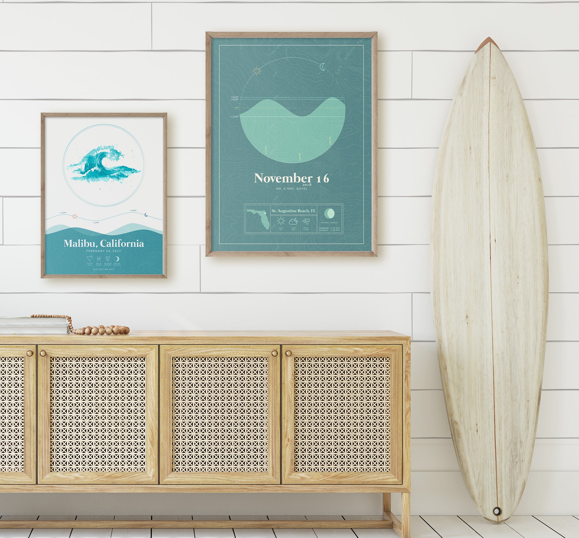 Waves Tide Map Poster and Nautical Tide Map Poster on a wall next to a surfboard in a home setting. Waves Tide Map Posters by Salt Atlas are custom posters showing the tide, astrology zodiac sign, and moon phase for a special day, like an anniversary or birthday.